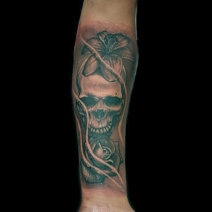 skull and flowers tattoo