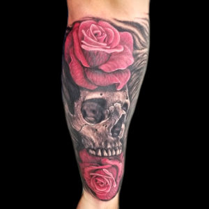 skull and red roses tattoo