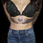 angel wings underboob tattoo