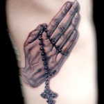 Praying hands tattoo