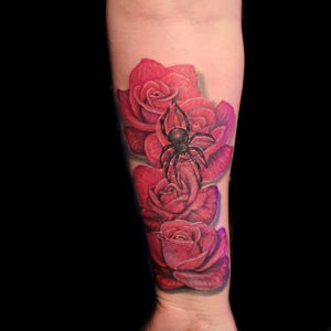 realistic red roses and black widow spider tattoo